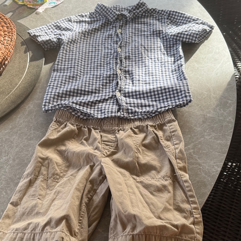 Carter’s navy and white plus shirt and khaki shorts.